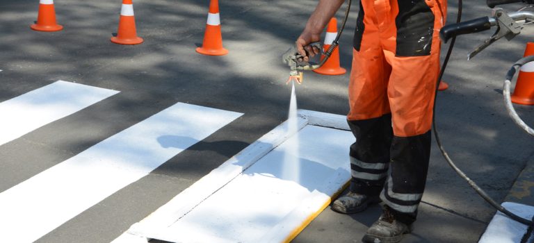 Worker,Is,Painting,A,Pedestrian,Crosswalk.